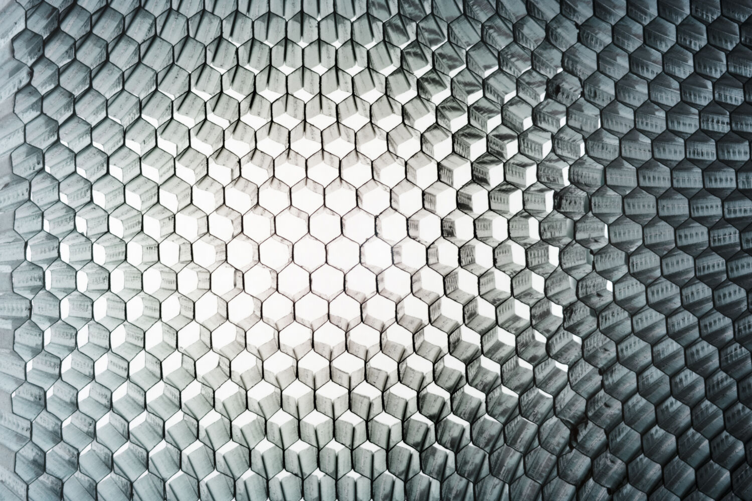 Abstract metal hexagonal grate representing advanced materials innovation